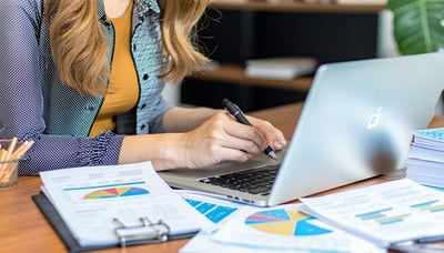 Bookkeeping expert reviewing financial records on a laptop with QuickBooks Online